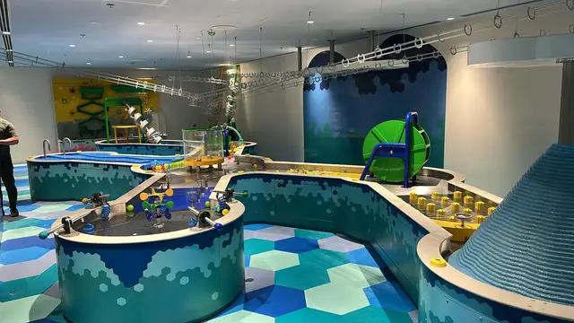 Interactive water play area with giant water tables at Explorers Mirdif Dubai